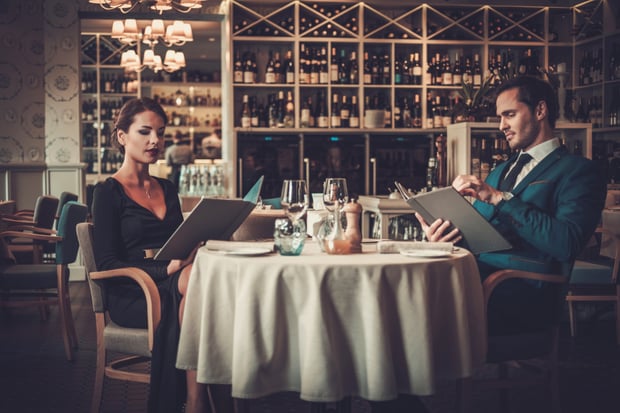 couple-reading-menu-in-a-restaurant-2021-08-26-16-21-14-utc